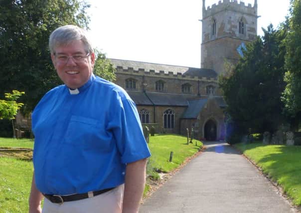 The Rev Canon Ian Robinson outside Caistor Parish Church EMN-160829-163326001