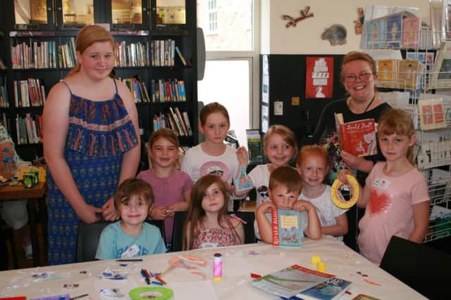 Workshop leader Robyn Finley (left) and Karen Hyde, Volunteer Librarian, with a group of young people who took part in Dream Catching  centred around the book Big Friendly Giant by childrens author Roald Dahl. EMN-160825-121432001