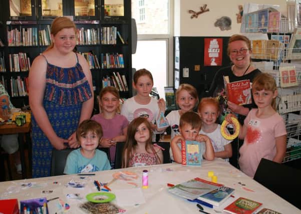 Workshop leader Robyn Finley (left) and Karen Hyde, Volunteer Librarian, with a group of young people who took part in Dream Catching  centred around the book Big Friendly Giant by childrens author Roald Dahl. EMN-160825-121432001