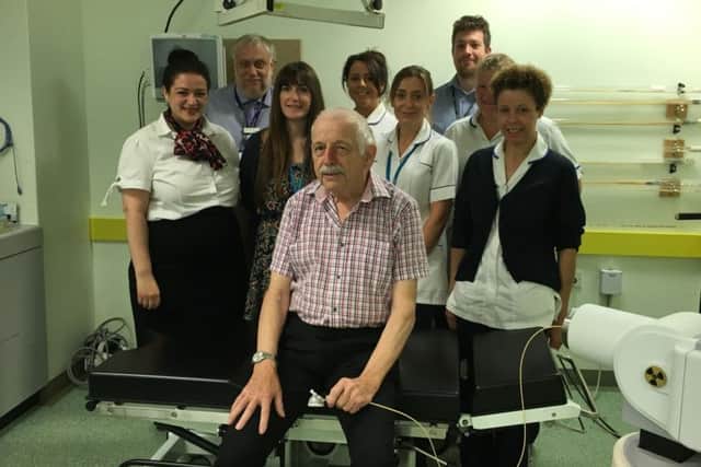 Patient Peter Walmsley with the team who carried out his brachytherapy treatment. EMN-160826-102737001
