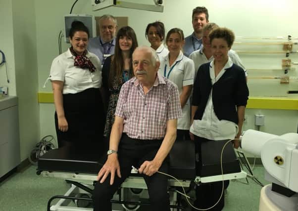 Patient Peter Walmsley with the team who carried out his brachytherapy treatment. EMN-160826-102737001