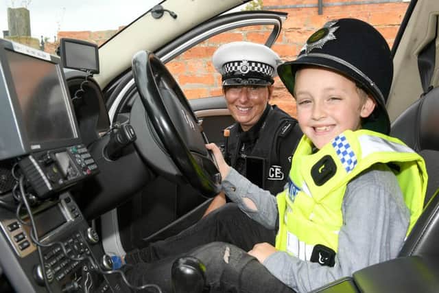 Police Roadshow at Sainburys car park with Police Commissioner and Depty Commissioner. Malakie Wyle 8 with PC Louise Ramsay. EMN-160829-124322001
