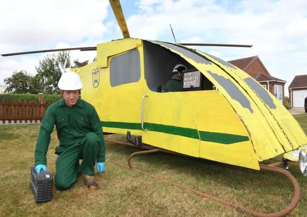 Scarecrow festival, dog show and produce show at North Kyme. David Machin with his scarecrow and air ambulance.