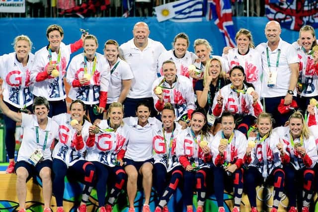 Hannah Macleod and Crista Cullen join their team to celebrate. Photographer