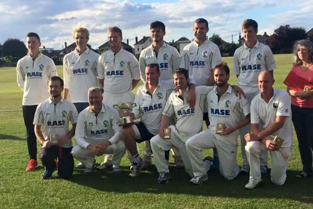 Market Rasen captain Dale Christie and team with the George Marshall Trophy EMN-160824-173217002