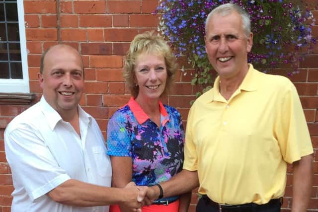 Mixed open winners Robert Wilson (left) and Rose Stevenson with Colin Burkitt EMN-160825-113157002