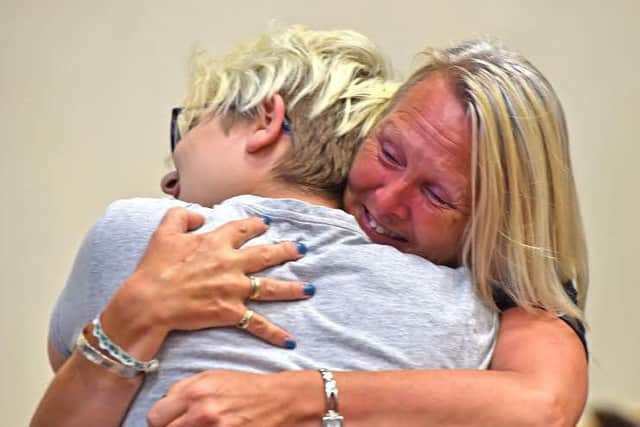 Mum's the word: Charlotte Clarke gets a hug from delighted mum Sandy at Barnes Wallis Academy EMN-160825-124040001