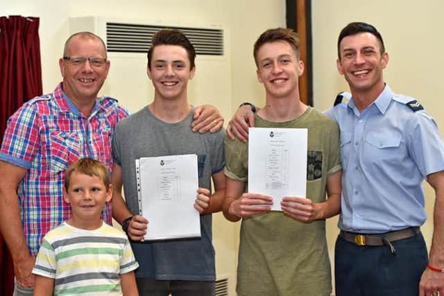 Family effort: A happy line up at Barnes Wallis Academy, from left to right, dad Jon Guite, William Guite (8), Charlie Guite, Ben Masters and dad Rick Masters EMN-160825-124053001