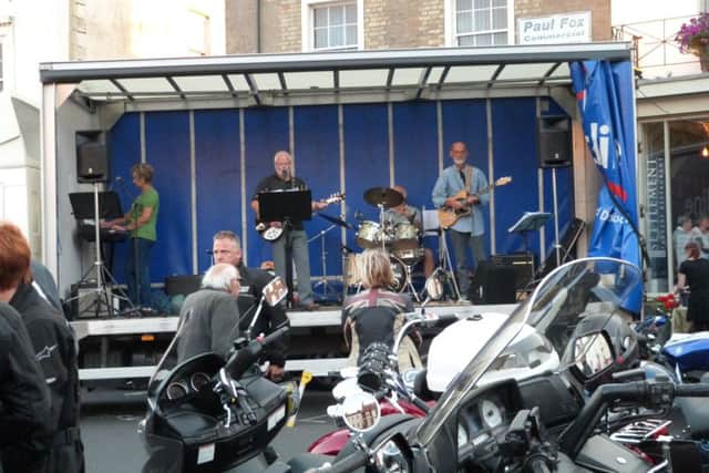 The Midnight Ramblers entertaining the crowds at caistor Bike Night. (Lin) EMN-160825-131525001