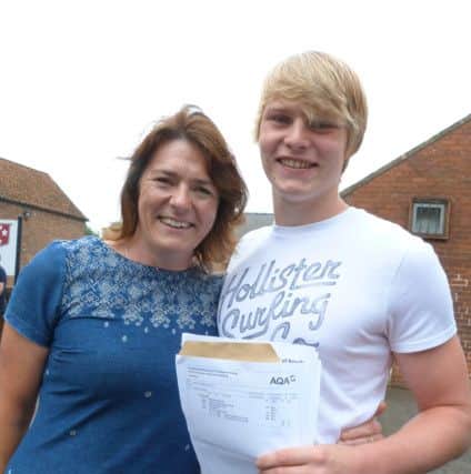 Freddie Marris (4A*s 6As 1b) with his mum. Freddie said: I am really chuffed with my results, epecially the German. I am staying at the school to study maths, further maths and physics. EMN-160825-142246001