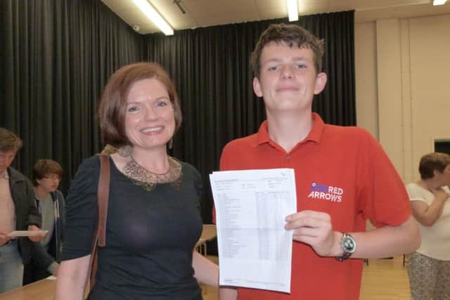 Teacher of Physics Elaine Wood congratulating Simon Blackshaw on his results.  (Lin) EMN-160825-155931001
