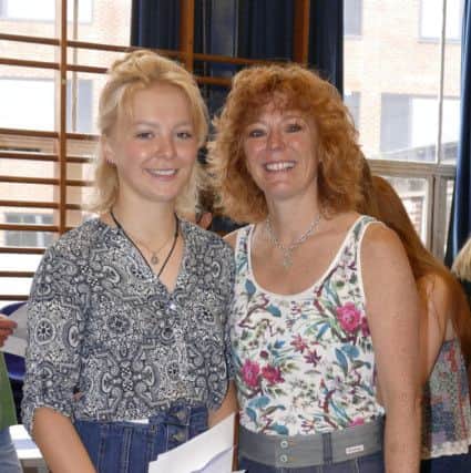 Vale Academy student Megan Porteous and her mum Vickie celebrate. Megan achieving six A*grades, four A and one C grade. EMN-160825-170125001