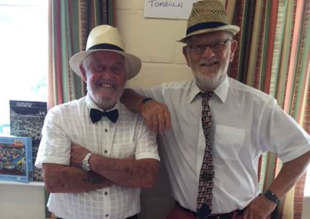 Coningsby and Tattershall Lions Bill and Peter getting in the mood at the Headway Victorian tea party EMN-160828-204242001