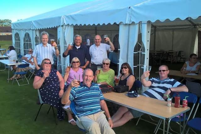 Cheers: A group of friends enjoy the atmosphere at Horncastle Beer Festival EMN-160829-093416001