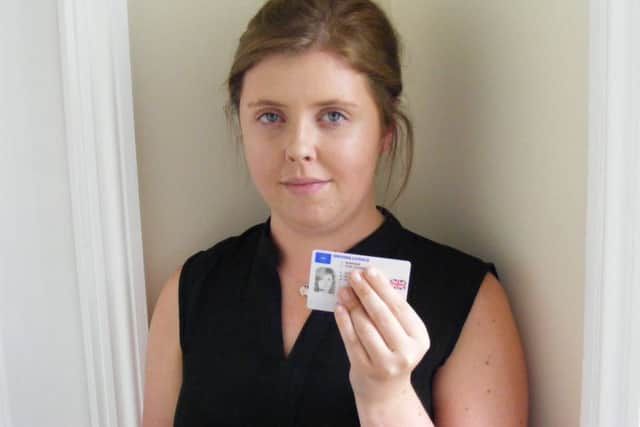 Georgia Burrows with her replacement licence. EMN-160209-123731001