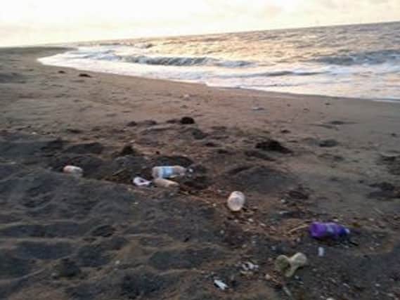 Rubbish on Ingoldmells beach. ANL-160831-151609001