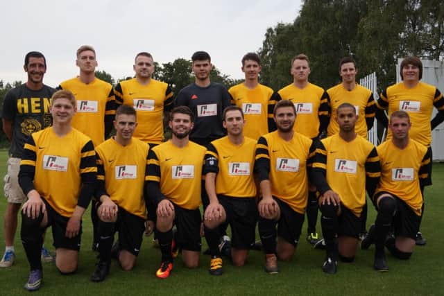Market Rasen Town pictured in their new kit, sponsored by Hilltop Engineering and Fabrication. With manager Craig Korytnickyj on the left EMN-160109-124611002
