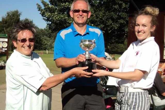 Richard and Leah Marshall are presented with the Phillips Family Trophy by competition secretary Jenny Brundle EMN-160509-114955002