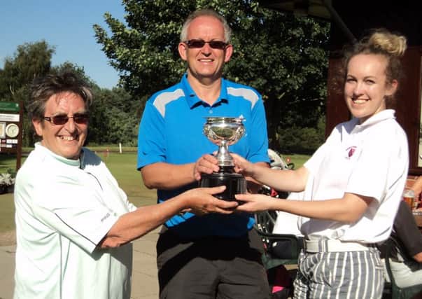 Richard and Leah Marshall are presented with the Phillips Family Trophy by competition secretary Jenny Brundle EMN-160509-114955002