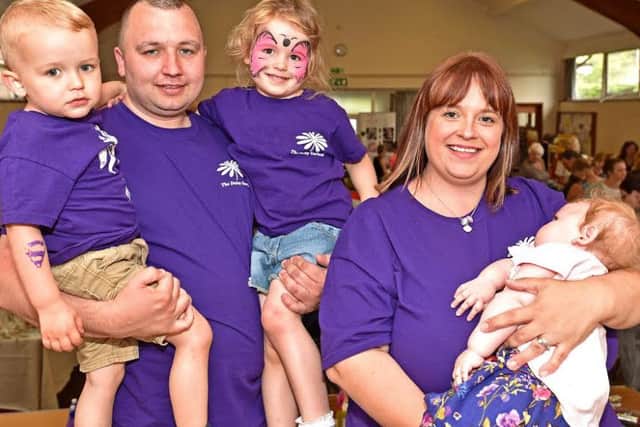 The Butler family with mum Stacey holding Olivia EMN-160509-131137001
