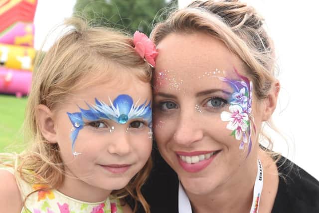 Lucy Bannister and Eleanor Massey with painted faces at Ancaster Show. EMN-160709-094340001