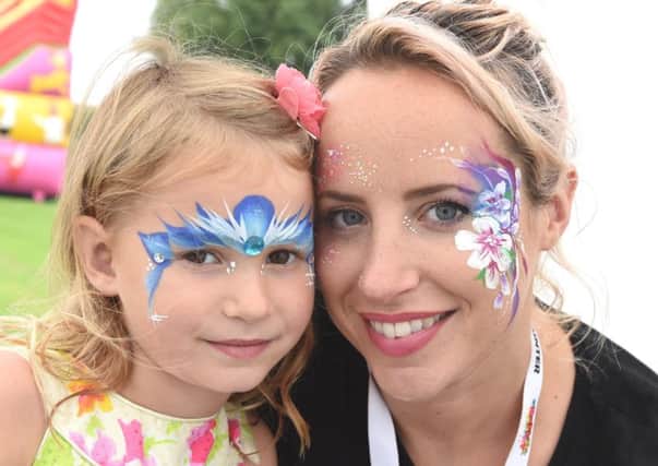 Lucy Bannister and Eleanor Massey with painted faces at Ancaster Show. EMN-160709-094340001