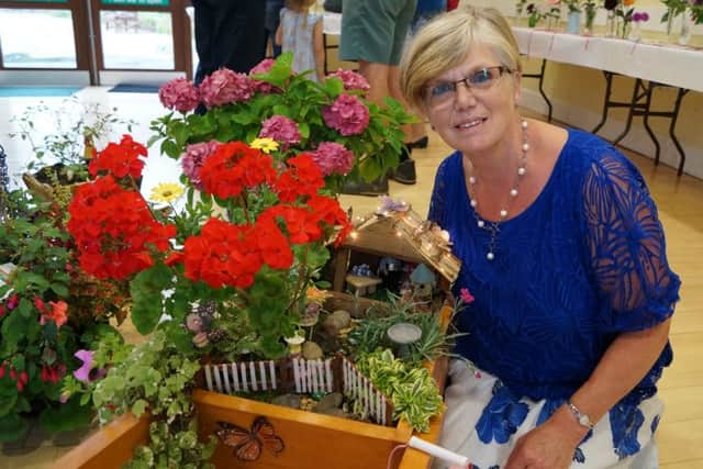 Maureen Dunn with her winning decorated wheelbarrow, one of many wins at the Nettleton Show EMN-160709-070543001