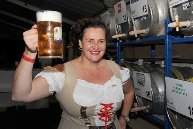Last year's Sleaford Oktoberfest organised by Sleaford Round Table. Member of Sleaford Ladies Circle, Alex Bennett, keeps the beer flowing for customers. EMN-160909-110447001