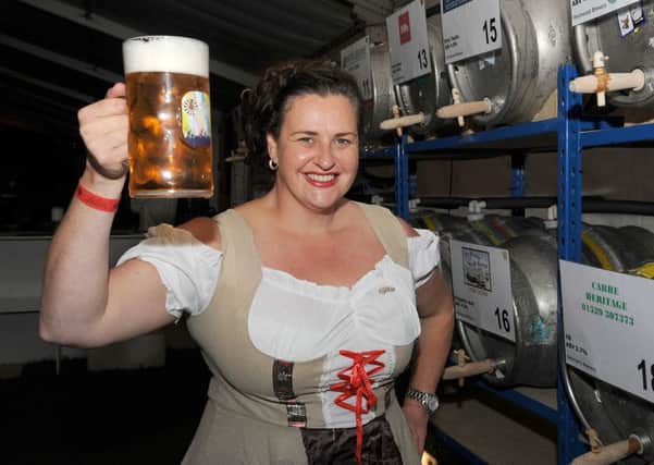 Last year's Sleaford Oktoberfest organised by Sleaford Round Table. Member of Sleaford Ladies Circle, Alex Bennett, keeps the beer flowing for customers. EMN-160909-110447001
