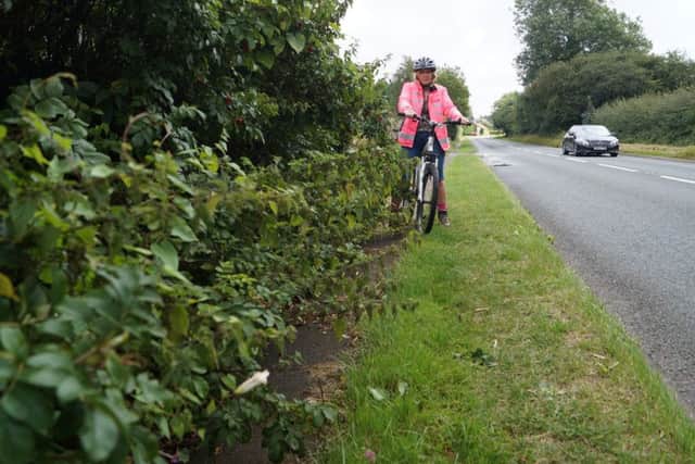 Cyclist Mandy Curtis on the blocked path near North Willingham EMN-160809-083508001