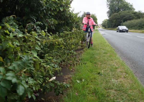 Cyclist Mandy Curtis on the blocked path near North Willingham EMN-160809-083508001