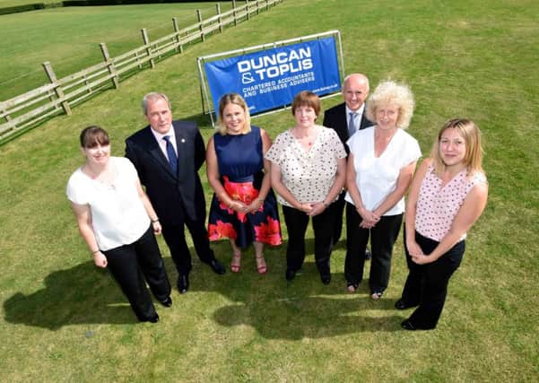 Pictured are (from left) Tracy Foster (Sleaford office - 15 years), managing director Adrian Reynolds, Annette Stewart (Boston office - 15 years), Sandy Jarratt (Boston office - 15 years), director Ian Phillips, Linda Steele (Melton office - 25 years) and Lisa Watson (Newark office - 15 years).