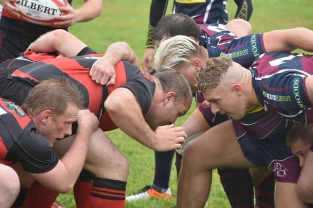 Crouch, bind, set . . . Sleaford and Spalding engage in a scrum. J5IaK7i3a3crB6tIVQos