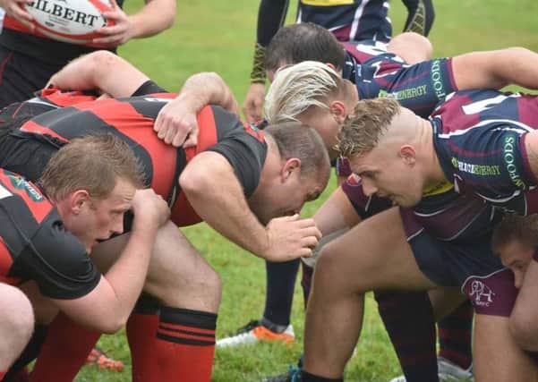 Crouch, bind, set . . . Sleaford and Spalding engage in a scrum. J5IaK7i3a3crB6tIVQos