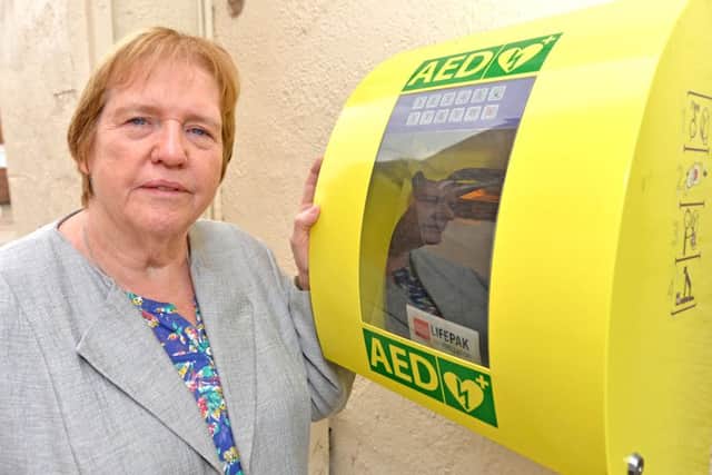 Town mayor Coun Angela Birchall with a defibrillator