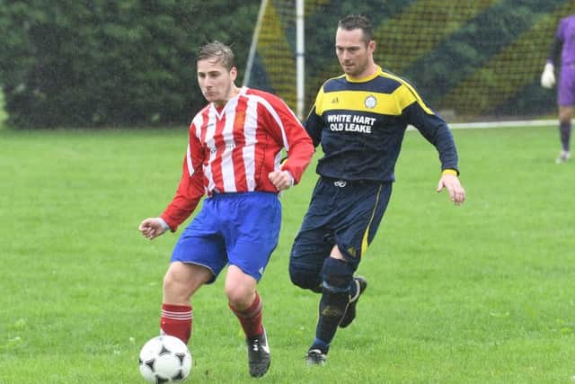 Alex Snaith looks to hold off Scott Mackay.