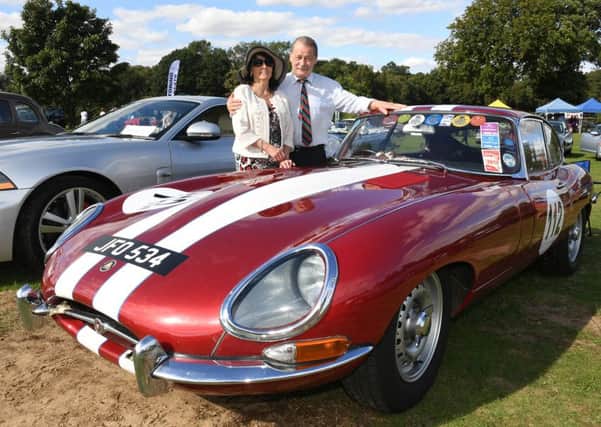 Jaguar Enthusiasts Club classic car show at Woodland Waters. Malvin Ward and Christobel Christopher of Ruskington, with their 1961 Jaguar E Type. EMN-160915-160026001
