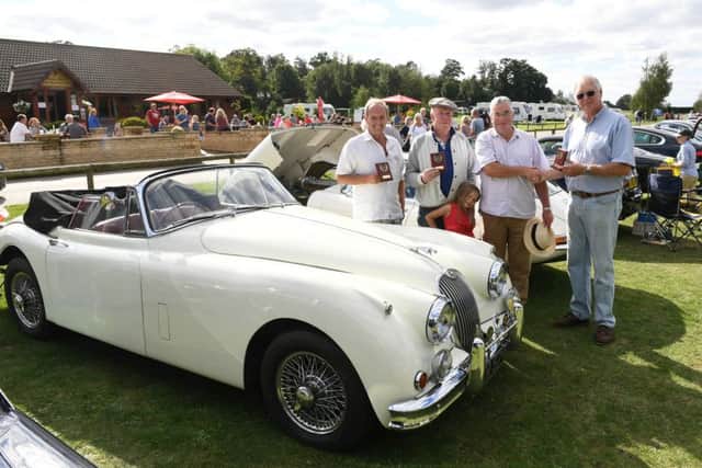 Jaguar Enthusiasts Club classic car show at Woodland Waters. L-R Peter Cremer of Grantham - winner of Best in Shoe for his 1958 Alfa Spider, Colin Noddings of Gratham with Ella Noddings 6 - winner of Best American Car for his 1948 Chevvy Stepside Truck, David Sullivan of Louth - winner of Best Jaguar for his 1958 XK150 (pictured), David Clare - chairman of JEC. EMN-160915-160042001