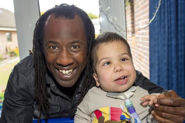 Childrens TV presenter Sid Sloane with 6 year old Harvey who is receiving special care at The Childrens Trust. EMN-160915-090112001