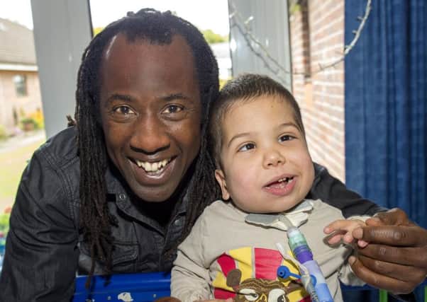 Childrens TV presenter Sid Sloane with 6 year old Harvey who is receiving special care at The Childrens Trust. EMN-160915-090112001