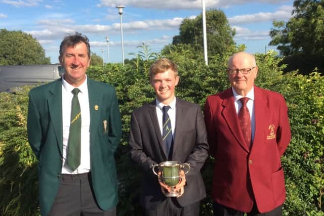 Butlin Cup winner Sam Done with Les Toyne (left), president-elect of the Lincolnshire Union of Golf Clubs, and South Kyme Golf Clubs mens captain Mick Mawson (right) EMN-160915-141233002