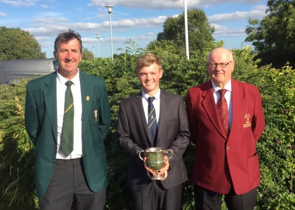 Butlin Cup winner Sam Done with Les Toyne (left), president-elect of the Lincolnshire Union of Golf Clubs, and South Kyme Golf Clubs mens captain Mick Mawson (right) EMN-160915-141233002