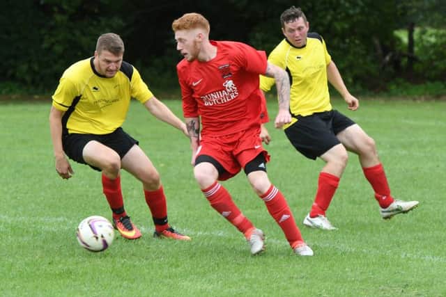 Kirton's Alex Cammack battled with Friskney's Jed Stainton and Ben Leech.