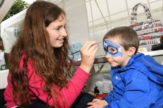 Sleaford and District Round Table Oktoberfest. Lucy Freeman 14, Luke Cooper 3, face painting. EMN-160919-112829001