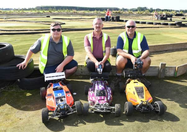 Remote Control Car national racing competition at North Ings Farm. Members of North Ings Raceway L-R Roger Smith, Paul Parker, Andrew Gilbert. EMN-160919-183036001
