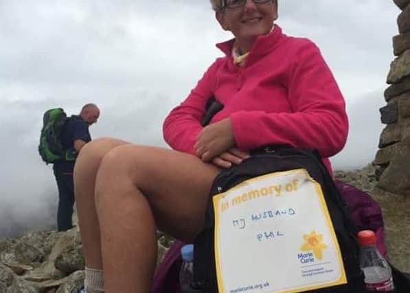 Paula Bowcock pictured whilst scaling Scafell Pike in memory of her husband Phil EMN-160921-132424001