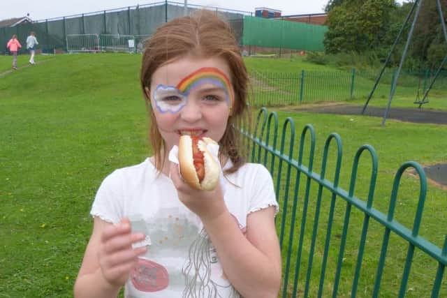 Demi Turner enjoying her hot dog. EMN-160921-170427001