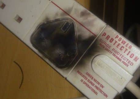 The charred plug of the lead bought to charge a Samsung S5. ANL-160922-173449001