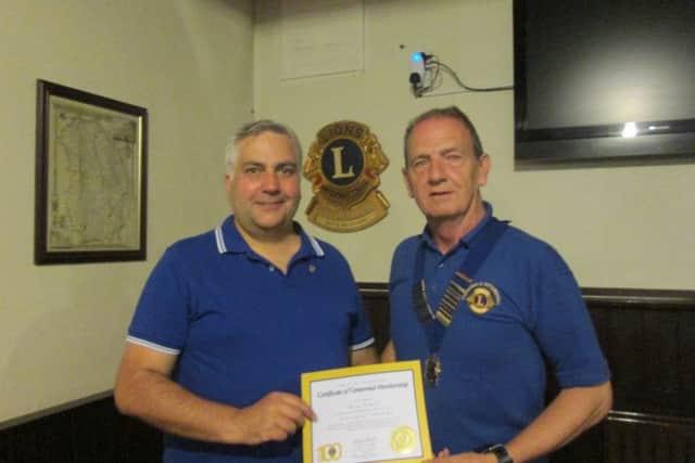 Brian Haskett with Lion President Neil Marshall. EMN-160923-105156001