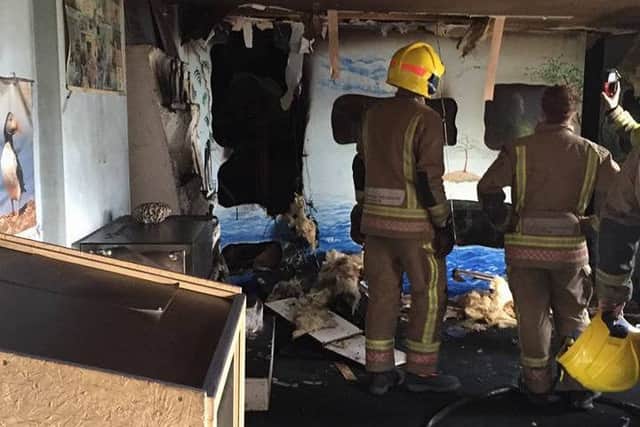 Firefighters survey the damage at Mablethorpe Seal Sanctuary. EMN-160925-114641001